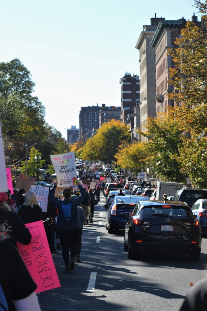 The march continues on Beacon Street around Boston Common